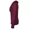 Side profile of a berry coloured long sleeve Cowl Neck Jersey that is semi fitted with draped cowl