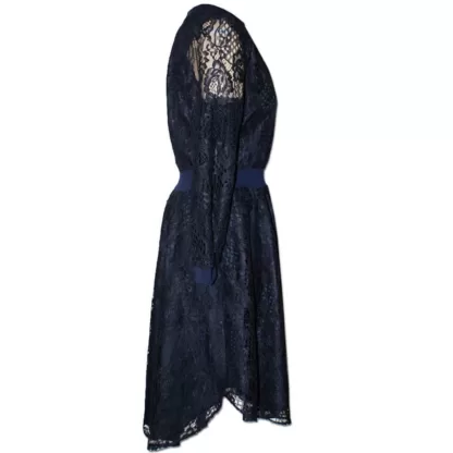 Navy Feminist Dress in Lace side view. Showing sheer arm sleeve and rib cuff. Side skirt detail that has a Shirt style hem.