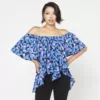 Sarah Blouse a Loose, womens blouse picture on model. This blouse is loose and flowing, has an elasticated neck with flared sleeves and a flared and gathered body with an uneven hemline.