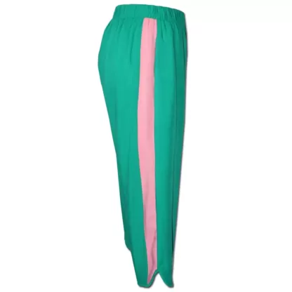 Side view of Side Swipe Pants. Effortless Pull on pants for women in an emerald green with a pink side stripe detail. Elastic waistband and in-seam pockets.